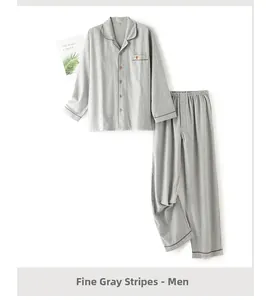 Detail of men's grey striped cotton pajama set with cute animal chest embroidery