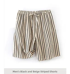 Detail view of men's black and cream striped cotton shorts with drawstring waist