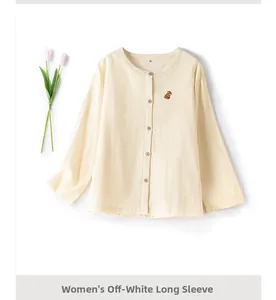 Detailed view of women's off-white cotton pajama shirt with delicate animal embroidery