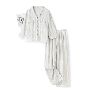 Panda embroidered cotton crepe pajama set for couples featuring a soft button-down top