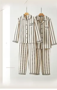 Detail of cream striped quilted air-layer cotton pajamas with panda pocket embroidery