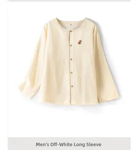 Detail of men's off-white cotton pajama top featuring delicate animal chest embroidery