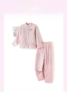 Detail showing plush texture and pink plaid pattern on thick winter thermal pajamas