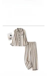 Detailed view of women's black and white striped thermal quilted pajamas with panda patch