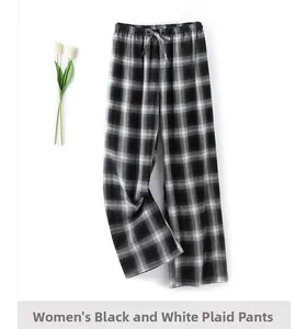 Close-up of women's black and white plaid cotton pajama pants with adjustable drawstring