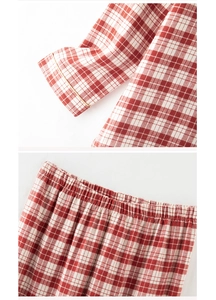 Detail of red and white plaid cotton pajamas showing elastic waistband and stitching
