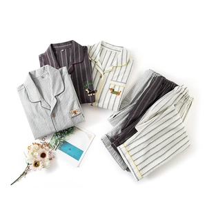 Cozy striped cotton pajama set for couples featuring cute dog embroidery and soft brushed fabric