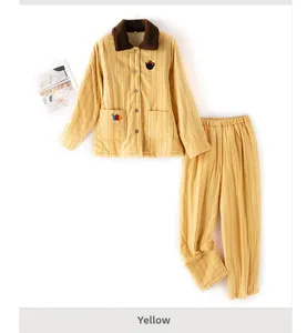 Detail of yellow striped thermal pajamas set with cute cat embroidery and plush collar