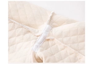 Detailed macro view of quilted thermal cotton pajamas with velcro strap and diamond pattern