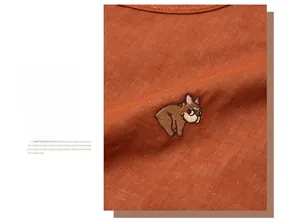 Detailed close-up of French Bulldog embroidery on breathable cotton pajamas
