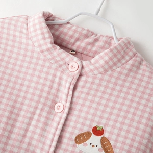 Plaid quilted thermal pajama set for women featuring pink embroidery and mock neck style