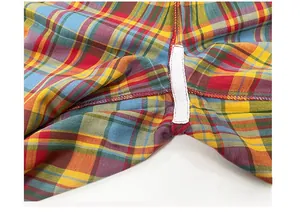 Macro detail of high-quality double-layer cotton gauze crotch seams and colorful plaid fabric