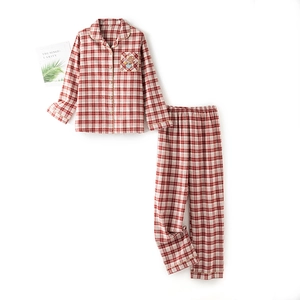 Classic red plaid long-sleeve cotton pajama set featuring a cute cartoon bear pocket patch