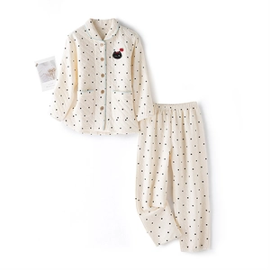 Kids quilted pajama set in cream with black polka dots and cute cat embroidery