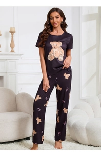 Detail of soft purple pajama set with cute bear print and cozy knitted fabric texture