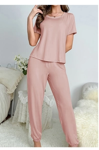 Close-up of dusty pink pajama set with short-sleeved top and elastic waistband pants