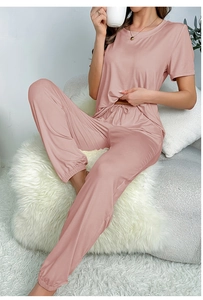 Detail of pink short-sleeve pajama set with drawstring waist and ribbed cuffs