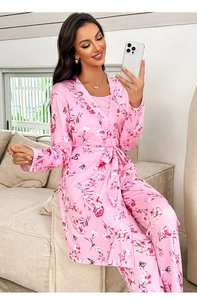 Detail view of pink floral satin pajama robe and trousers with silky texture finish