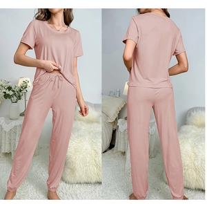 Women's pajama set featuring short sleeve top and drawstring jogger pants in mauve pink