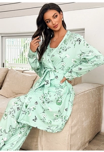 Detail view of mint green floral pajama set showing silk-like fabric texture and drape