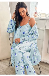 Detailed view of blue floral loungewear set with silky texture and elegant butterfly print