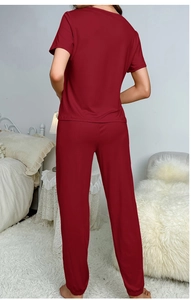 Rear view of a dark red two-piece pajama set with short sleeves and long pants