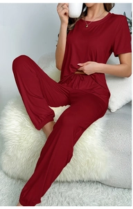 Detail of burgundy two-piece pajama set featuring soft knit fabric and drawstring waistband