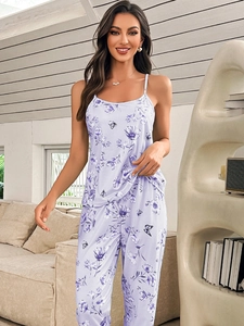 Detail of lavender pajama set with dark purple floral and butterfly prints on soft fabric