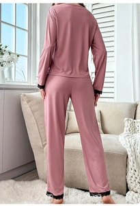 Rear view of pink long sleeve pajama set with lace trim on ribbed knit fabric