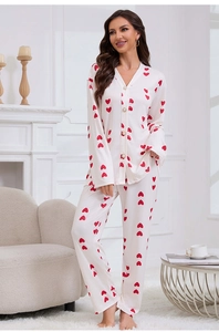 Close-up of heart print pajamas with pearl buttons and soft knit fabric details