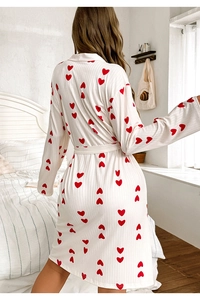 Rear view of long sleeve white heart print robe with textured fabric and waist tie