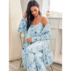 Three-piece light blue floral pajama set with camisole, trousers and robe in silk-like fabric