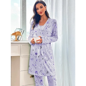 Light purple floral pajama set with long robe and matching pants in a home setting