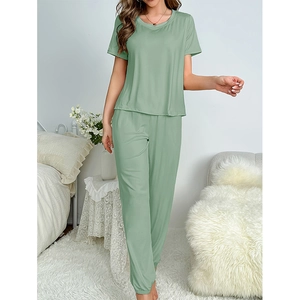 Women's sage green pajama set with short sleeve top and joggers in soft milk silk fabric