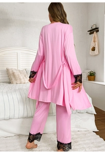 Rear view of pink silk sleepwear with elegant black lace trim on sleeves and hem