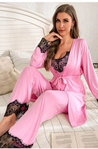 Detail of pink silk pajamas with delicate black eyelash lace trim on sleeves and cuffs
