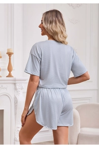 Back view of blue and white striped summer knit loungewear set with shorts and short sleeves