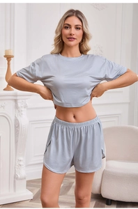 Detail of grey striped knit pajama set featuring short sleeves and elastic waist shorts
