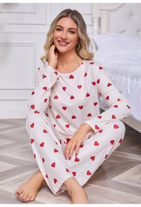 Detail view of the ribbed knit fabric with red heart prints on white pajama set