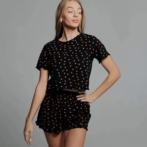 Women's black pajama set with red heart print featuring short sleeves and lettuce trim