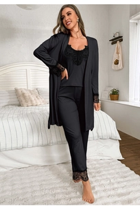 Detail of elegant black lace trim on silk pajama sleeves and neckline for women