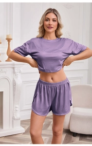 Detail of purple striped knitted pajamas set with round neck and elastic waistband shorts