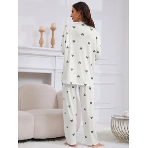 Women's 2-piece loungewear set featuring a heart print long sleeve top and ribbed trousers