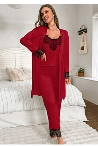 Detail of red satin pajamas set with intricate black lace trim on the robe and pants