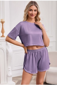 Detail of women's purple striped pajama set with cropped top and elastic shorts