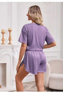 Detail view of purple striped knit loungewear set showing soft fabric and loose fit