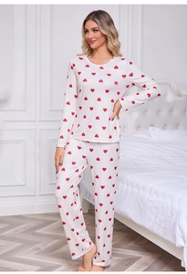 Detail of red heart print on white ribbed fabric of long-sleeved pajamas set for women