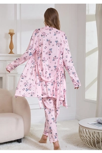 Detail of pink floral satin robe set with silky fabric and elegant flower patterns