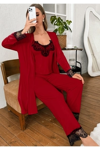 Detailed view of red silk satin pajamas set with black lace embroidery and v-neck design