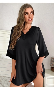 Close-up of black V-neck modal nightdress with delicate lace trim on sleeves and neckline